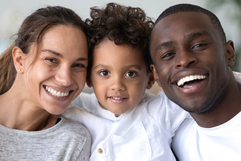 family smiling after dental procedure